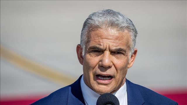 יאיר לפיד בטקס קבלת פנים של ביידן בנתב"ג, יולי 2022