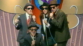 עפרה חזה, גידי גוב, מוני מושונוב, דב גליקמן. 1987